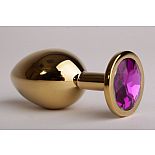 <strong>Золотистая анальная пробка с фиолетовым кристаллом - 8,2 см.</strong> <br />
Металлическая пробка с ограничительным основанием для безопасного использования. <div class="charTableblock"><div><span>Длина, см</span>: 8,2</div><div><span>Диаметр, см</span>: 3,4</div><div><span>Материал</span>: металл</div><div><span>Цвет</span>: другой</div><div><span>Особенности</span>: пробка; ювелирка</div><div><span>Особенности</span>: без вибрации; гладкая</div><div><span>Длина, см</span>: 5-8</div><div><span>Диаметр, см</span>: 3</div><div><span>Цвет кристалла</span>: голубой/синий/фиолетоый</div></div> Золотистая анальная пробка с фиолетовым кристаллом - 8,2 см.
Металлическая пробка с ограничительным основанием для безопасного использования.